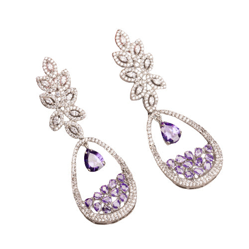 "Dark blue zircon dangler earrings offer a captivating, deep sparkle for a bold look."
