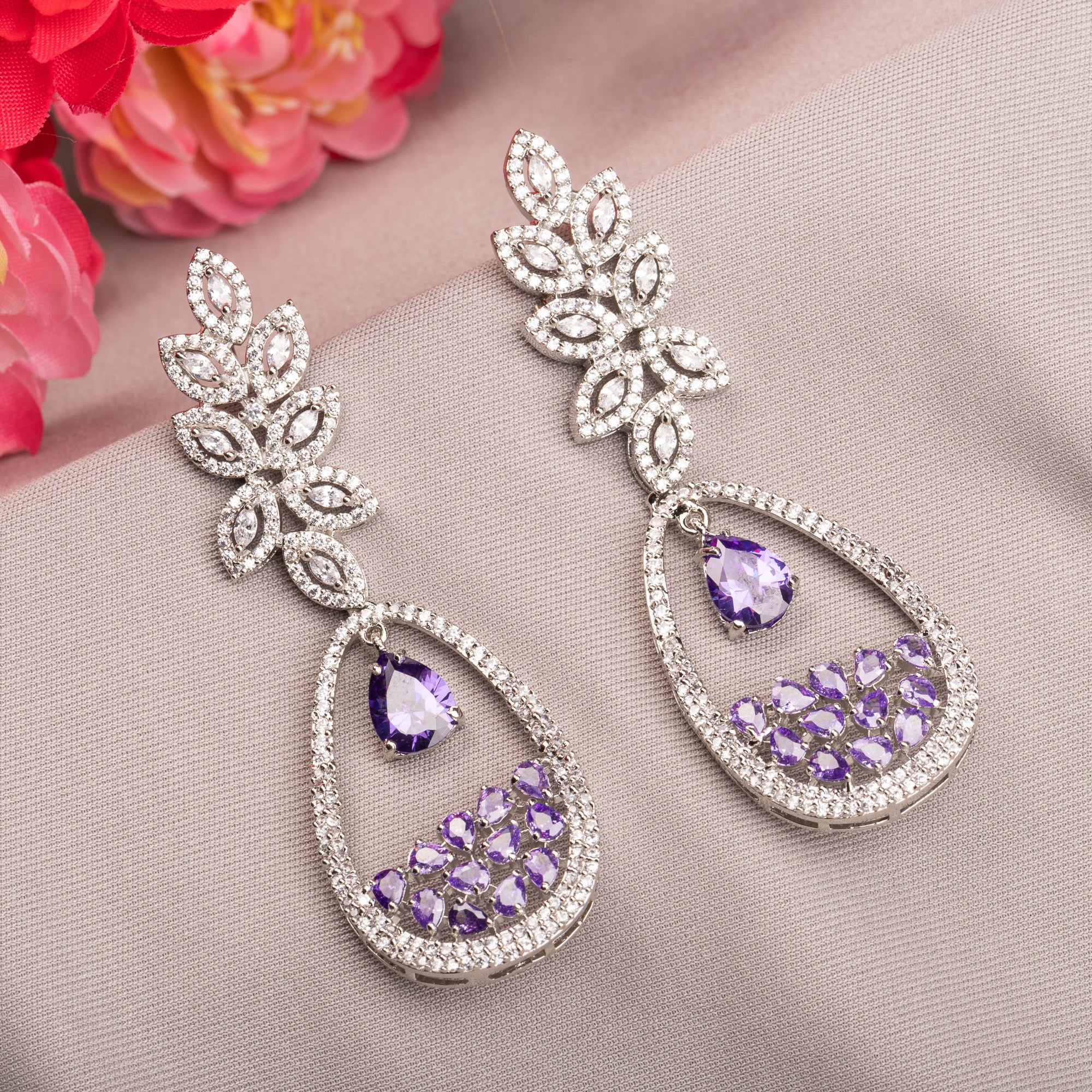 "Dark blue zircon dangler earrings offer a captivating, deep sparkle for a bold look."
