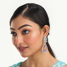"Dark blue zircon dangler earrings offer a captivating, deep sparkle for a bold look."
