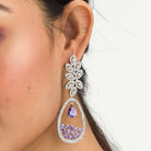 "Dark blue zircon dangler earrings offer a captivating, deep sparkle for a bold look."
