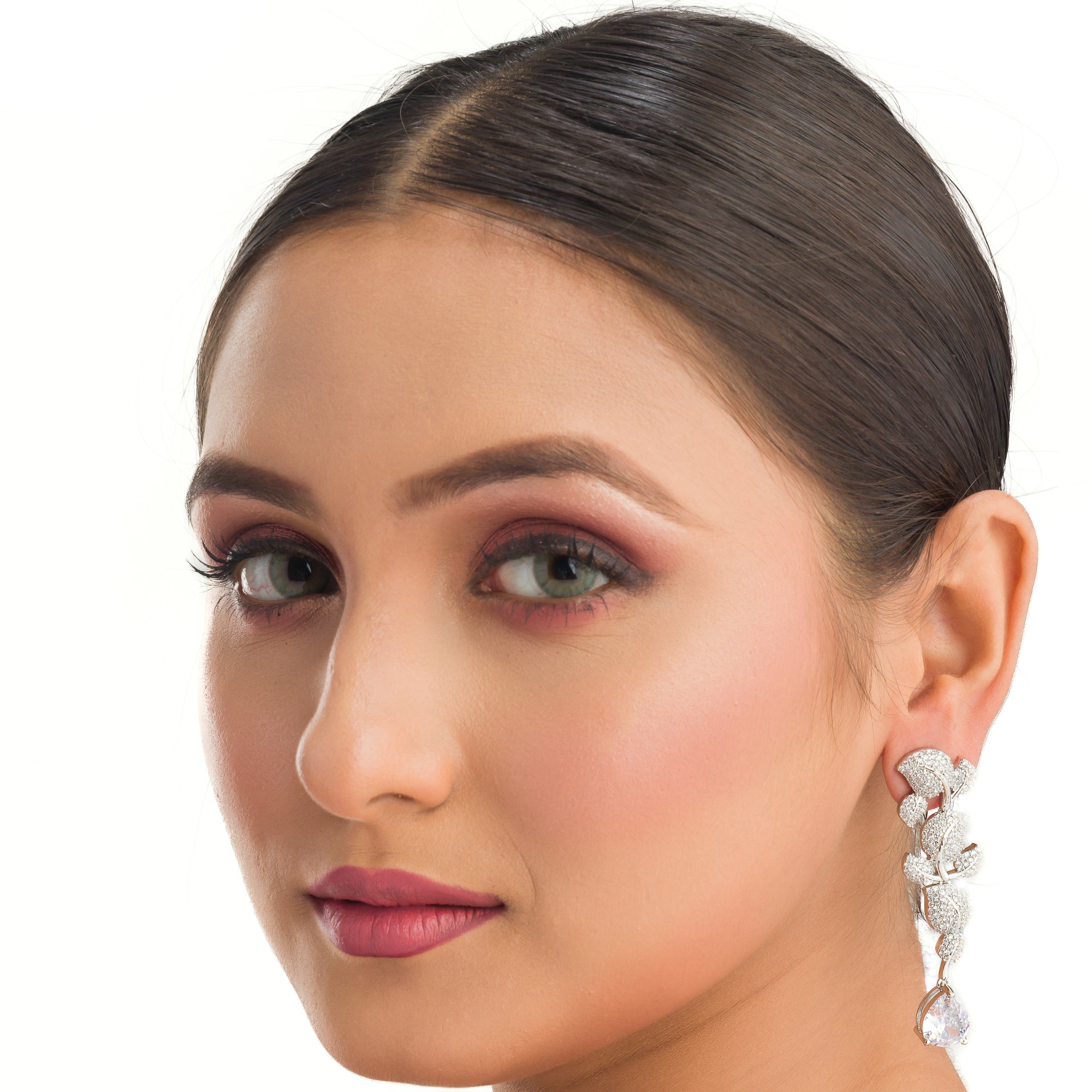 "Leaf design zircon earrings blend nature’s beauty with radiant zircon accents."
