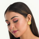 "Sun design Rani Victoria earrings mix regal elegance with timeless classic style."
