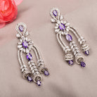 1. "Blue zircon dangler earrings shimmer with a captivating, deep sparkle for a bold look."
