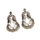 "Small oxidized earrings with two birds add vintage charm with intricate details."

