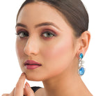 "Blue zircon dangler earrings exude a captivating sparkle, perfect for any party."
