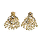 "Chandbali Kundan earrings with intricate design make a bold, regal statement."
