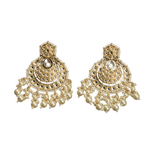 "Chandbali Kundan earrings with intricate design make a bold, regal statement."
