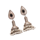 "Oxidized jhumka with black stone delivers a striking vintage allure for a timeless style."
