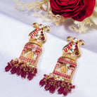 "Ganesh idol earrings with kundan and gold-tone polish add classic charm and grace."

