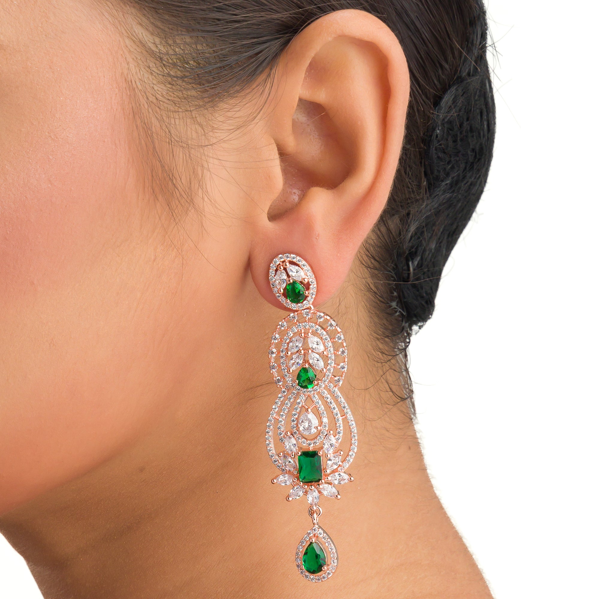 Green and white zircon earrings with rose gold polish exude vibrant elegance and style."
