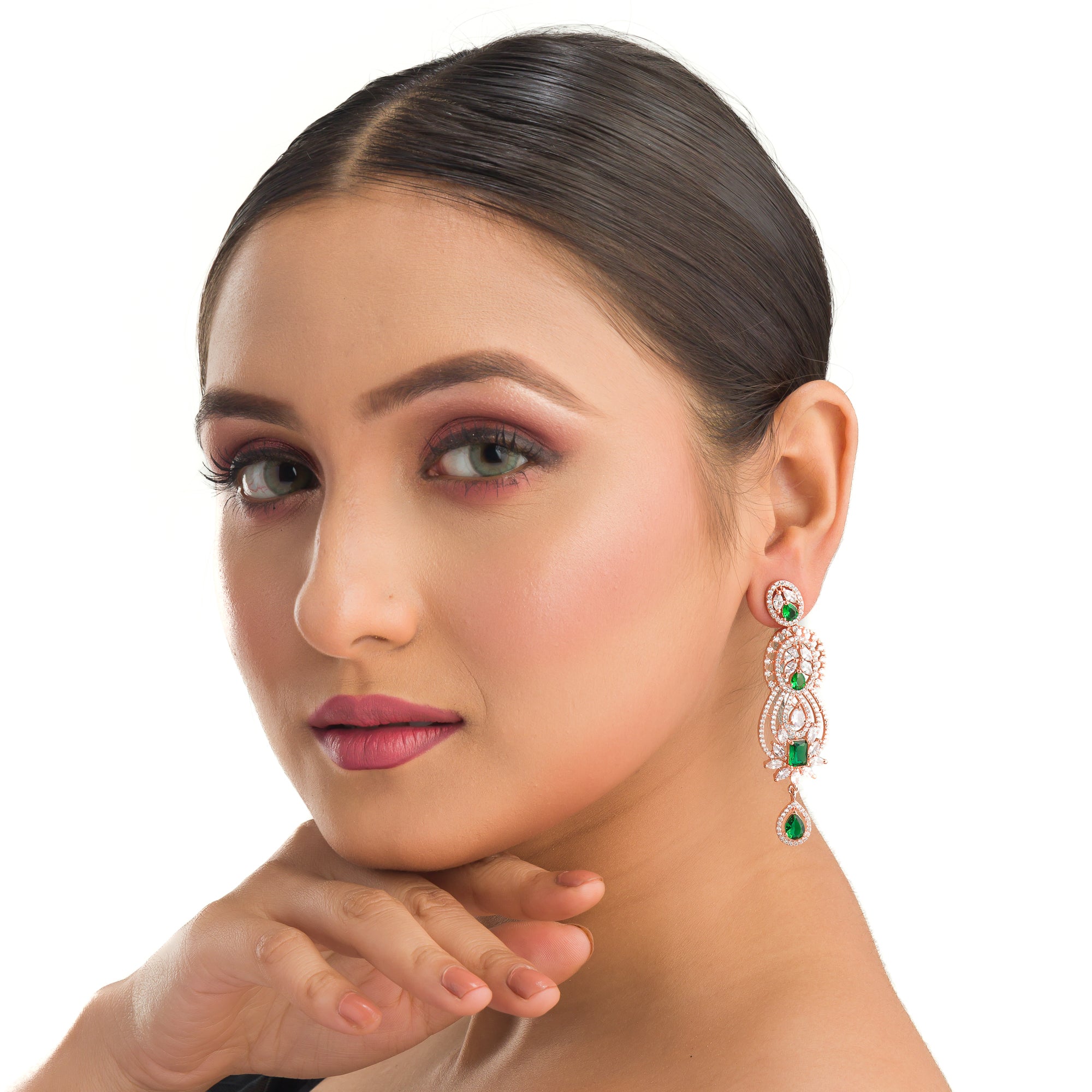 Green and white zircon earrings with rose gold polish exude vibrant elegance and style."
