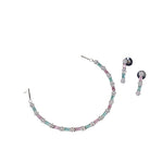 "Zircon silver necklace with pink and green accents adds a delicate, colorful touch."
