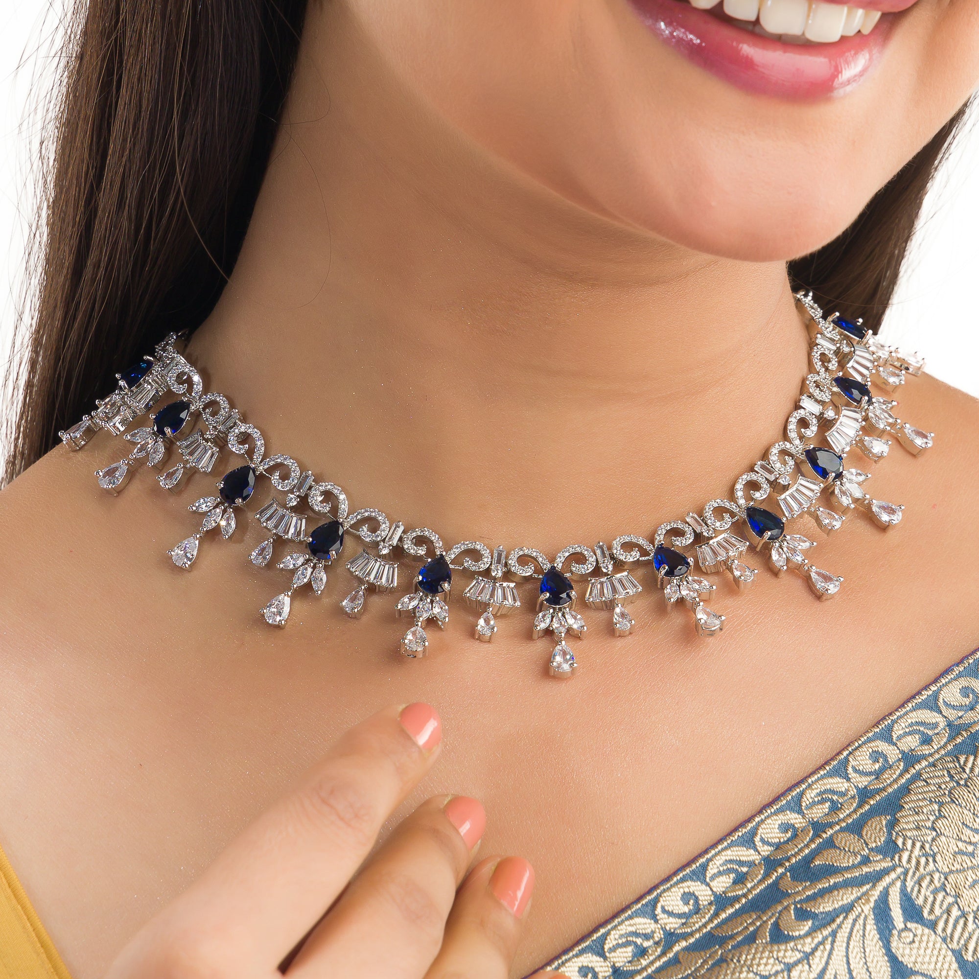 "Navy blue zircon necklace offers a sophisticated splash of color and sparkle."
