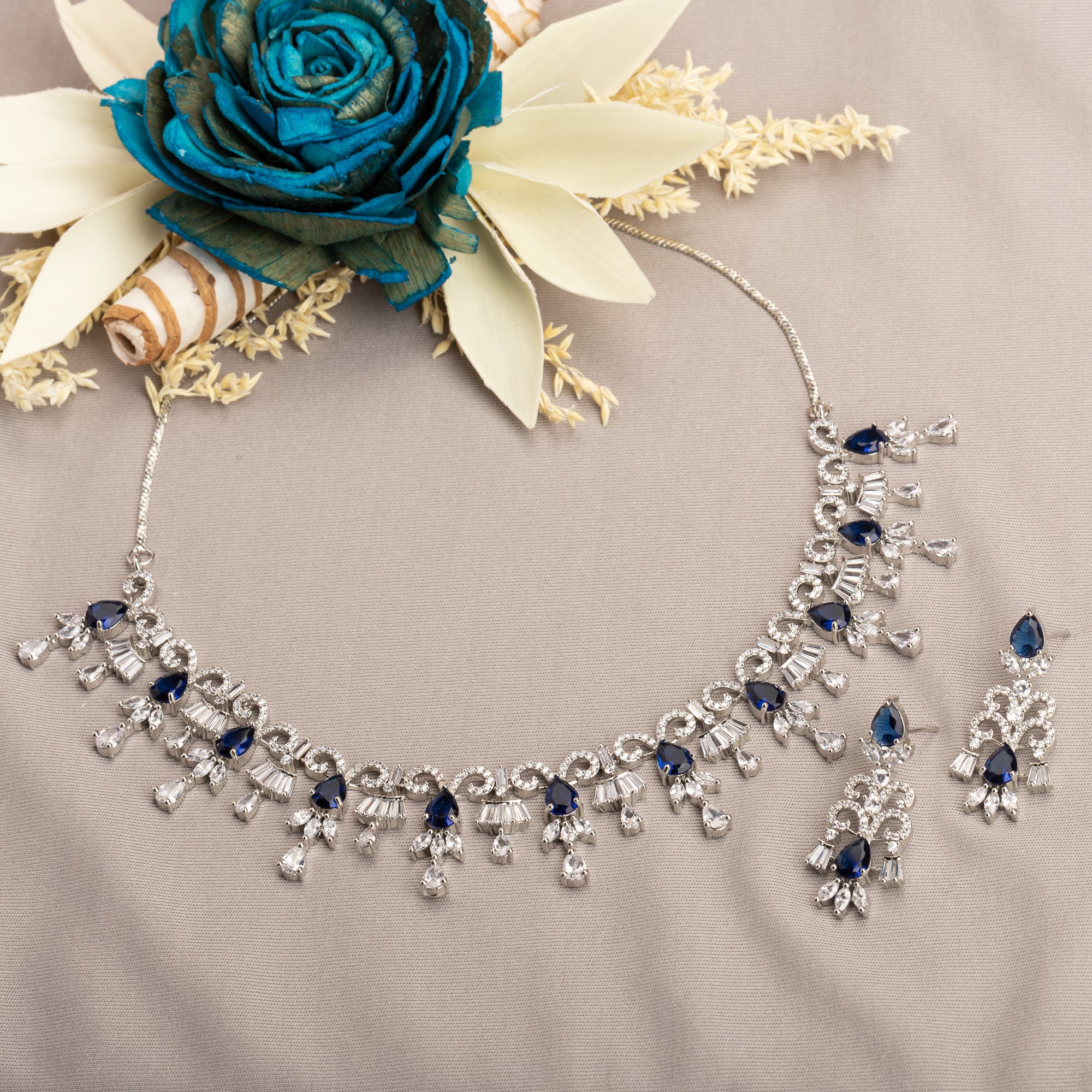 "Navy blue zircon necklace offers a sophisticated splash of color and sparkle."
