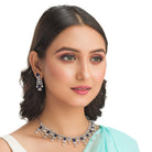 "Navy blue zircon necklace offers a sophisticated splash of color and sparkle."
