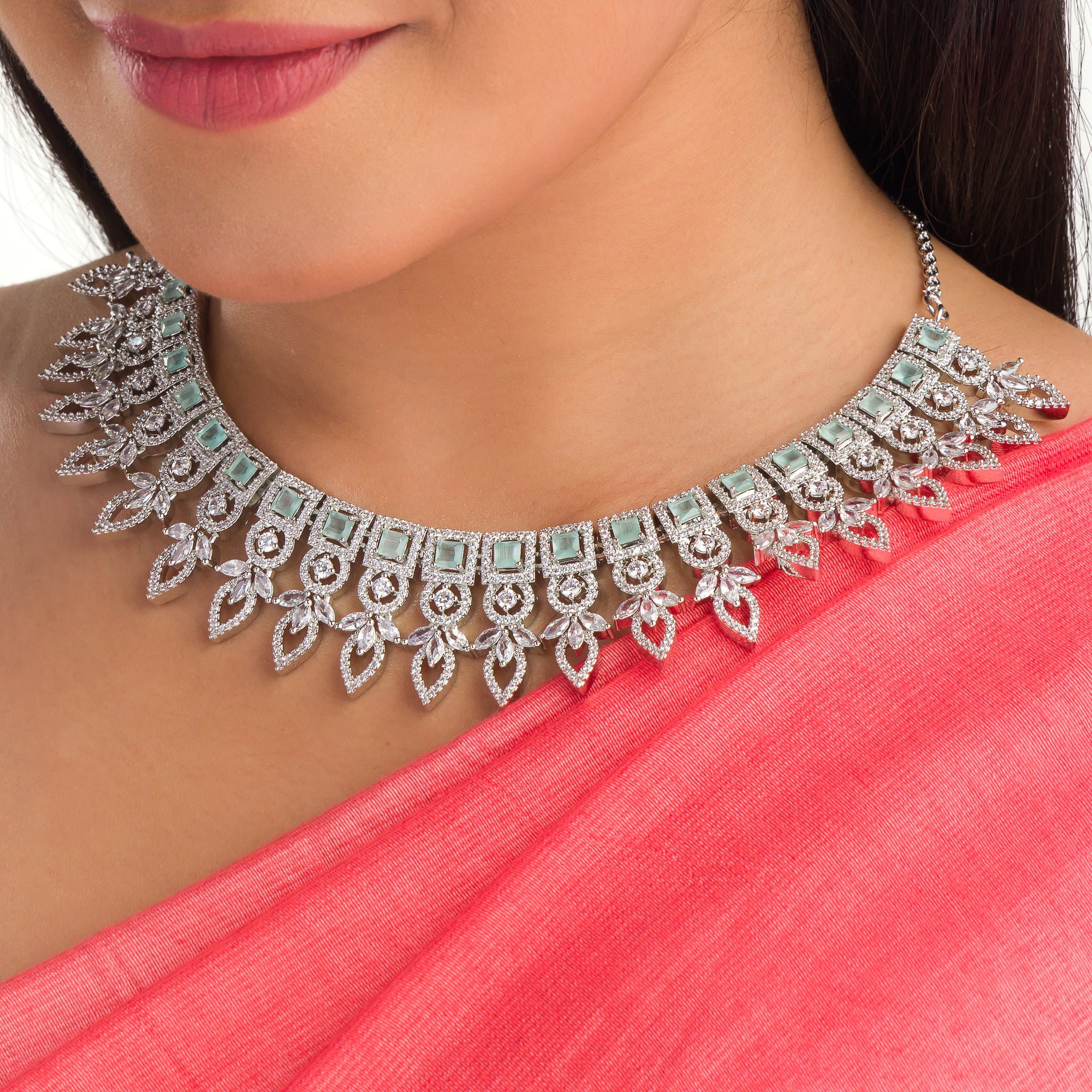 "Light green zircon necklace adds a fresh, subtle touch of elegance."
