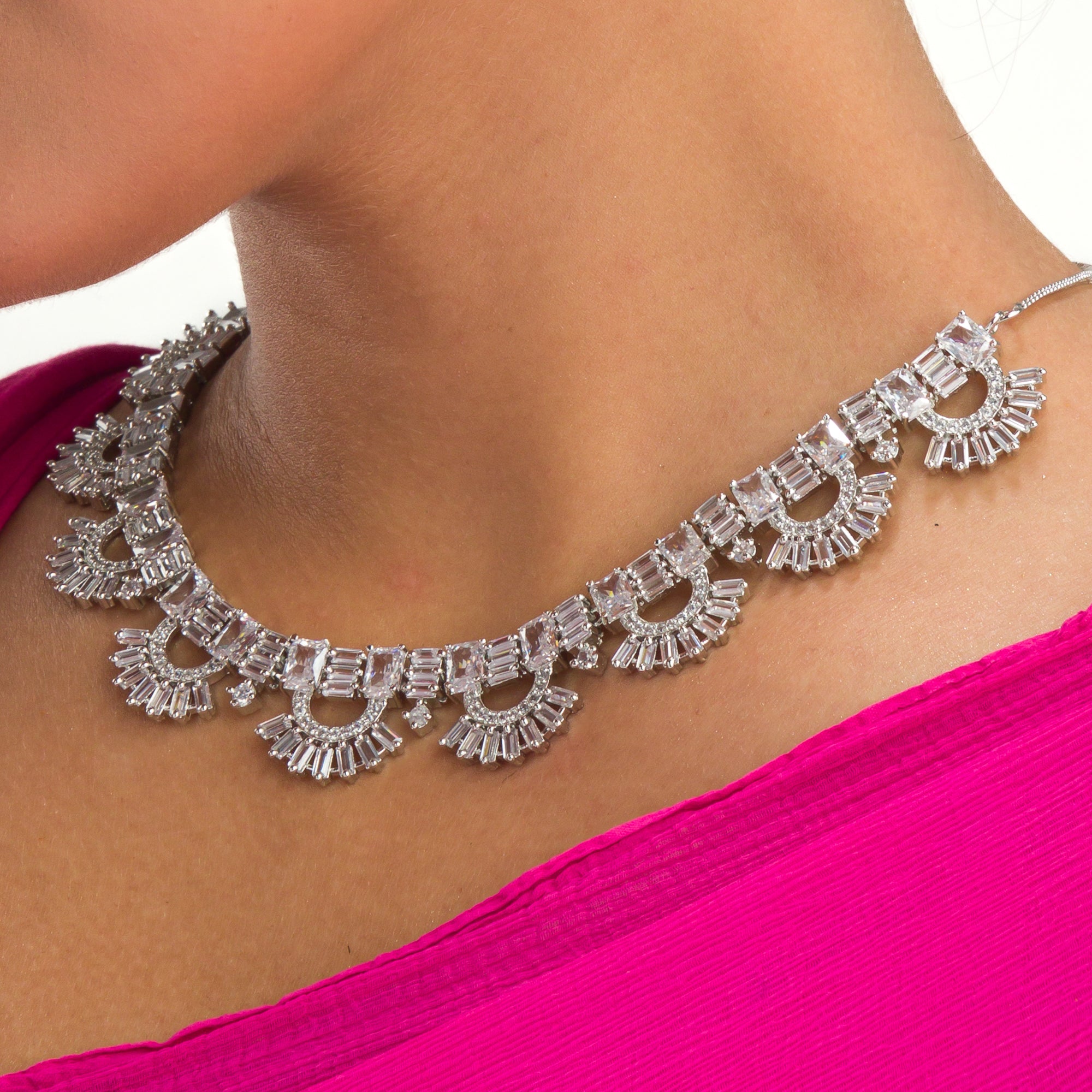 "Zircon necklace with infinity design symbolizes timeless elegance."
