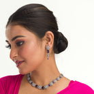 "Navy blue zircon short necklace delivers a sophisticated splash of color and sparkle."
