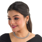"White zircon necklace offers timeless elegance with sparkling clarity."
