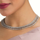 "White zircon necklace offers timeless elegance with sparkling clarity."
