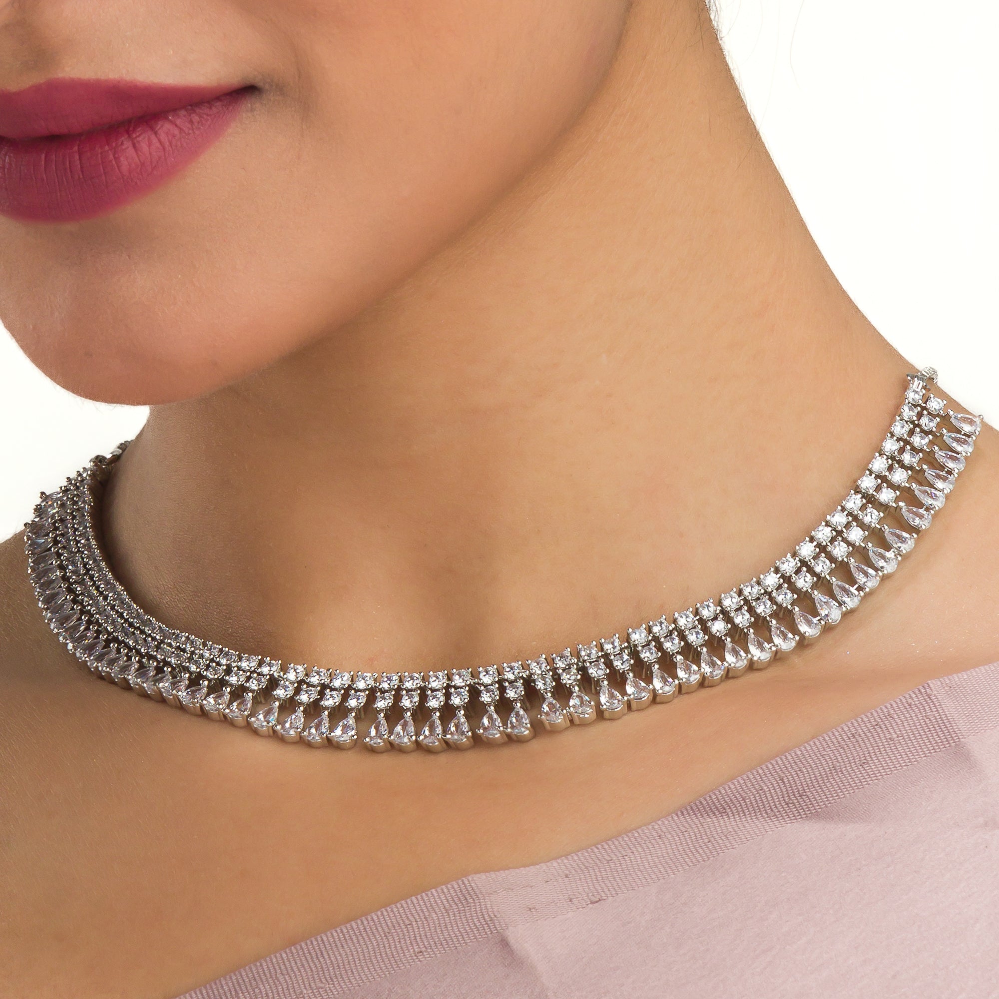 "White zircon necklace offers timeless elegance with sparkling clarity."
