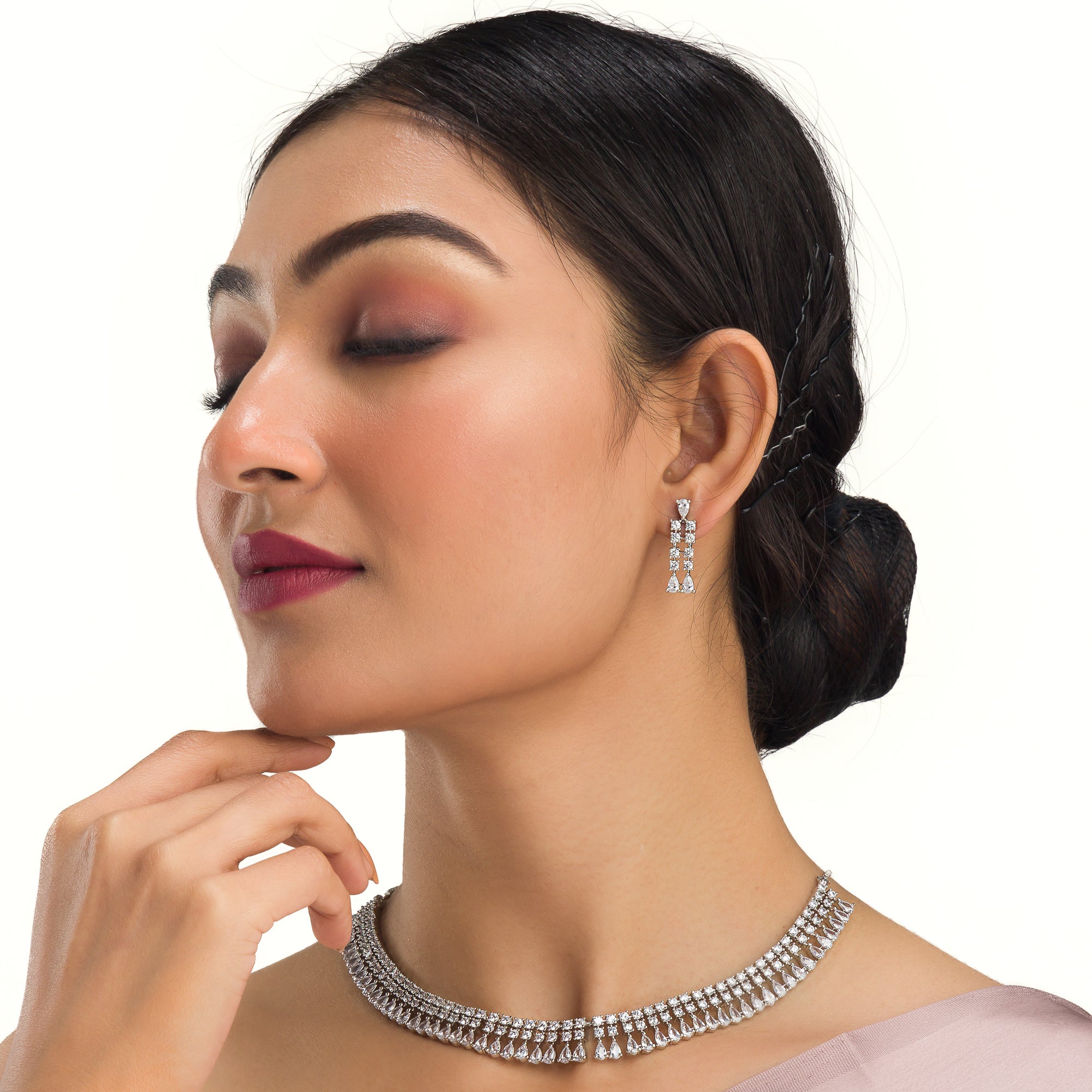 "White zircon necklace offers timeless elegance with sparkling clarity."
