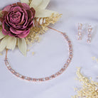 "Rose gold zircon necklace radiates timeless elegance with a warm shine."
