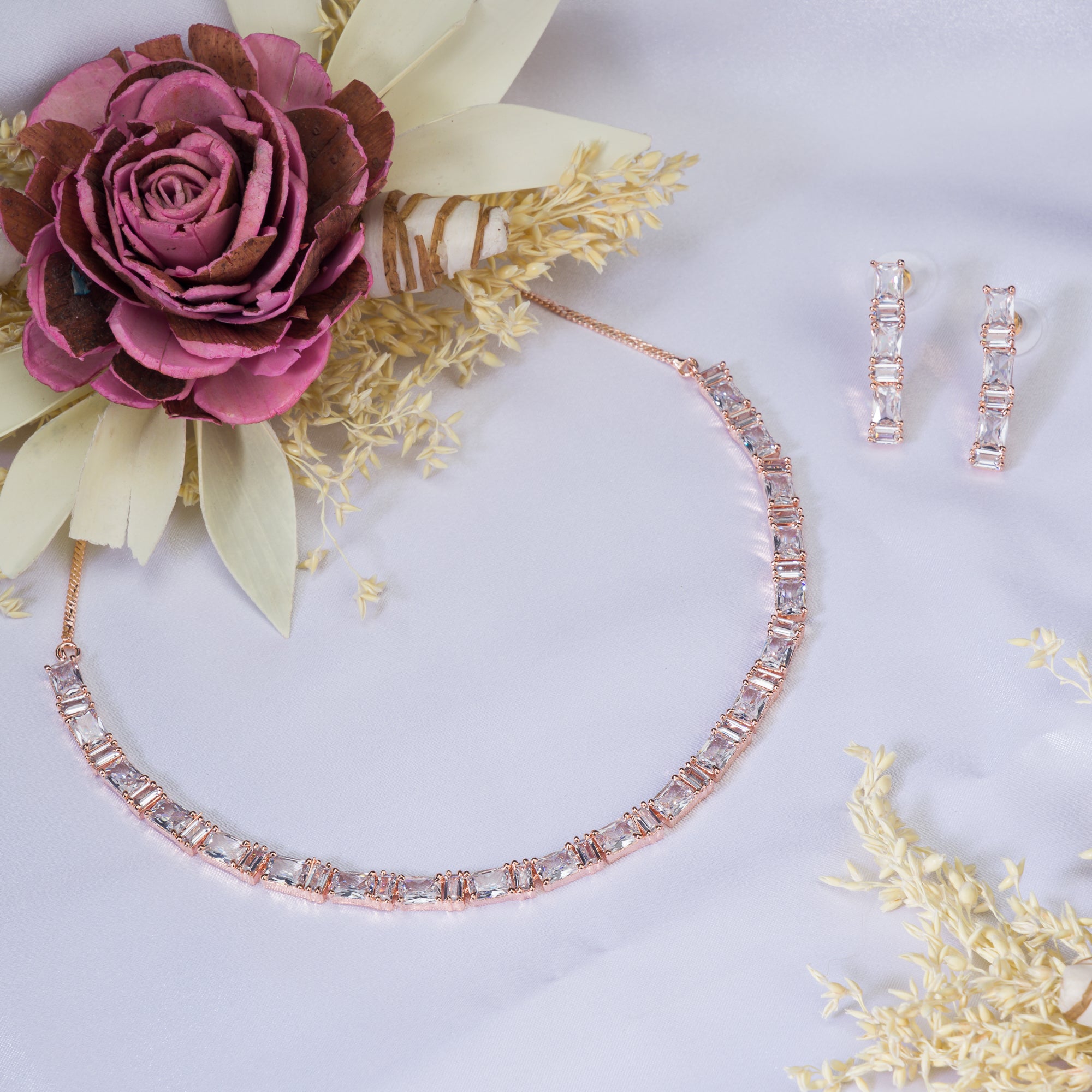 "Rose gold zircon necklace radiates timeless elegance with a warm shine."
