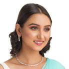 "Rose gold zircon necklace radiates timeless elegance with a warm shine."
