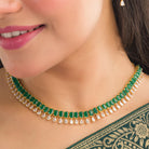 "Elegant green zircon necklace offers a vibrant splash of color and brilliance."
