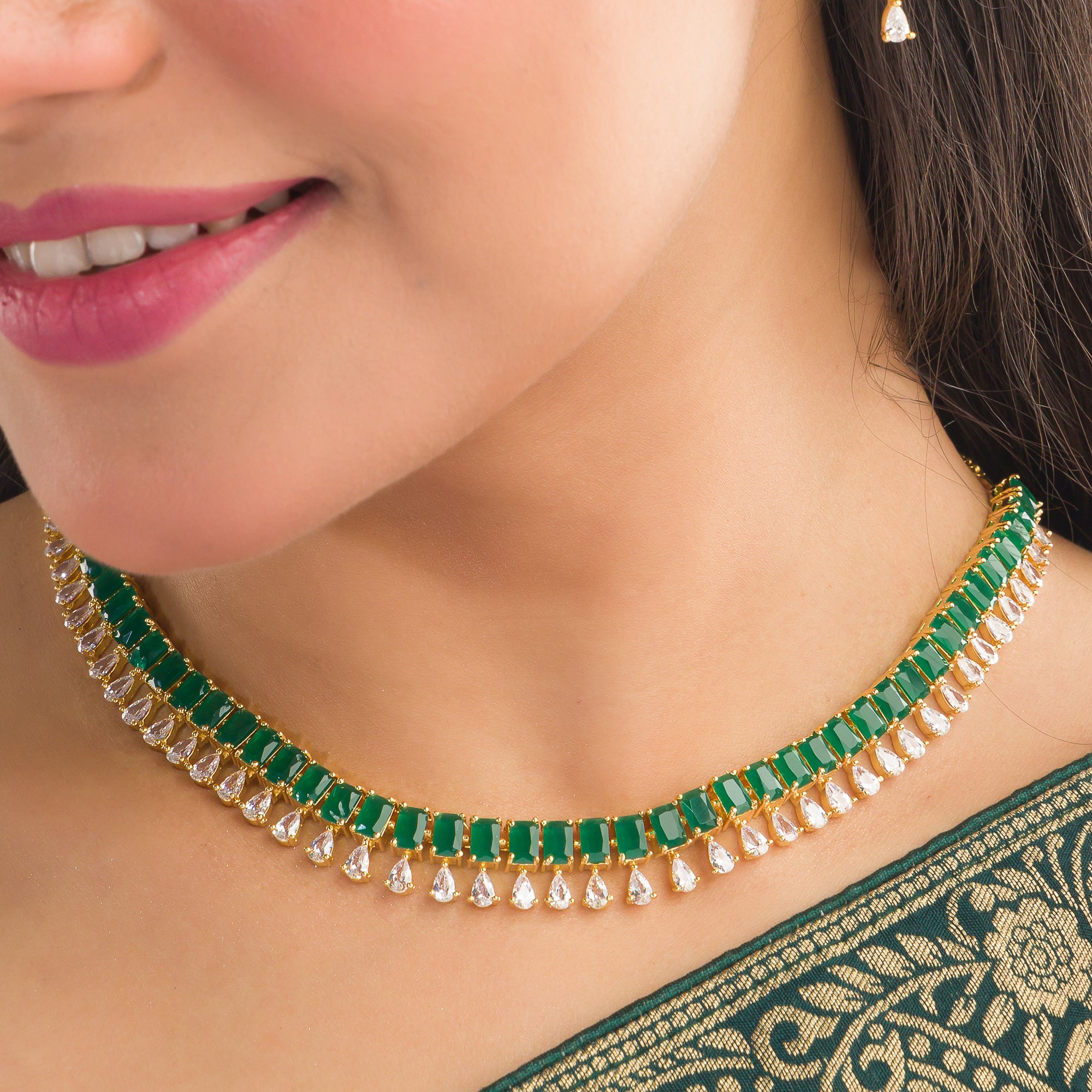 "Elegant green zircon necklace offers a vibrant splash of color and brilliance."
