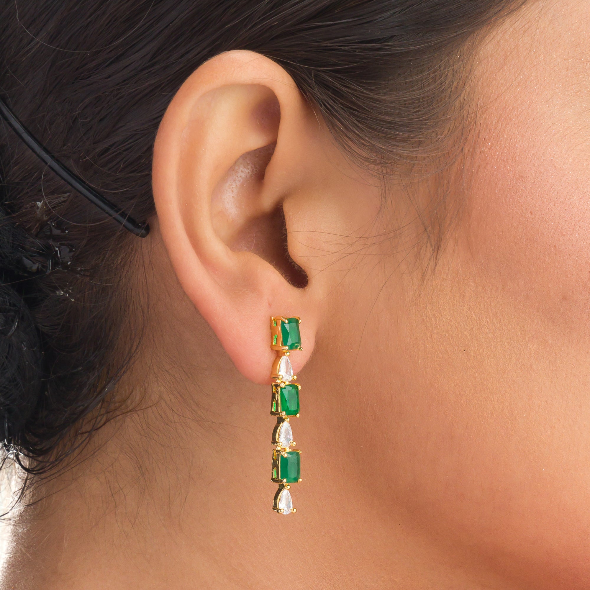 "Elegant green zircon necklace offers a vibrant splash of color and brilliance."
