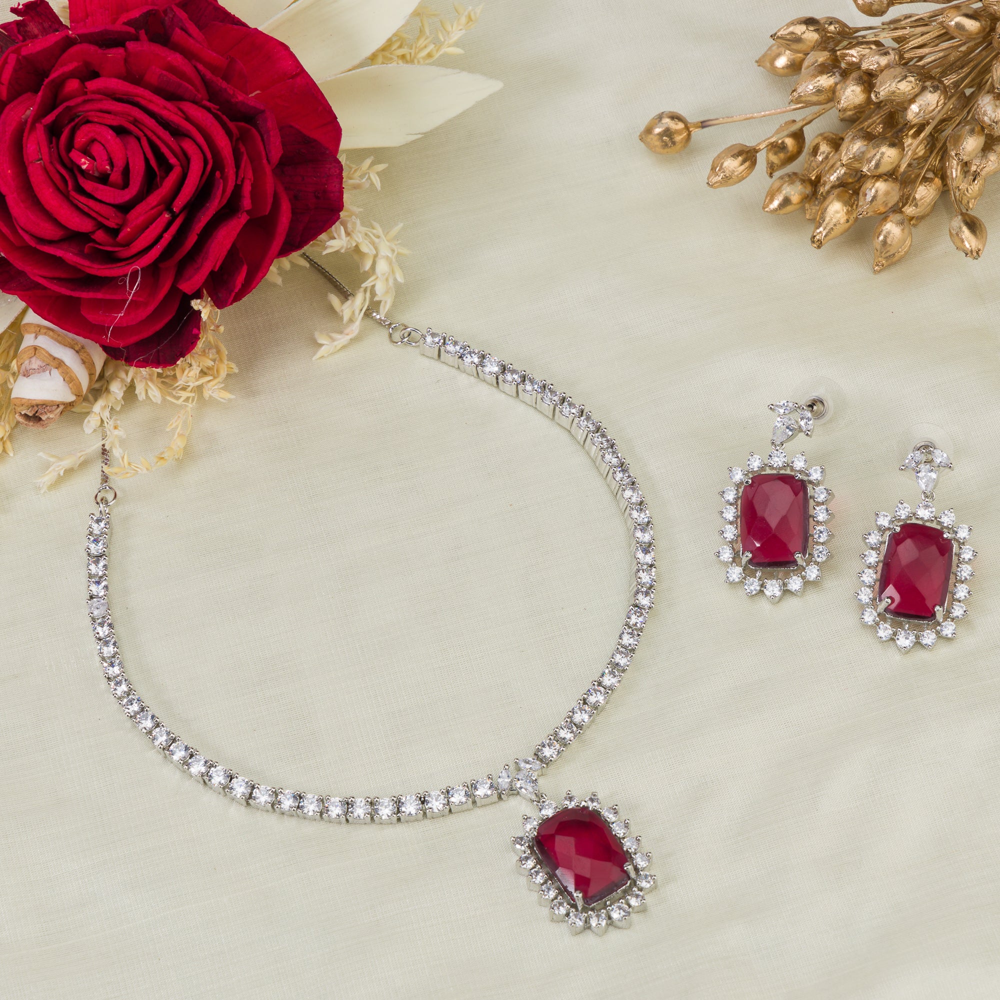 "Rich maroon zircon pendant necklace adds sophistication and elegance."
