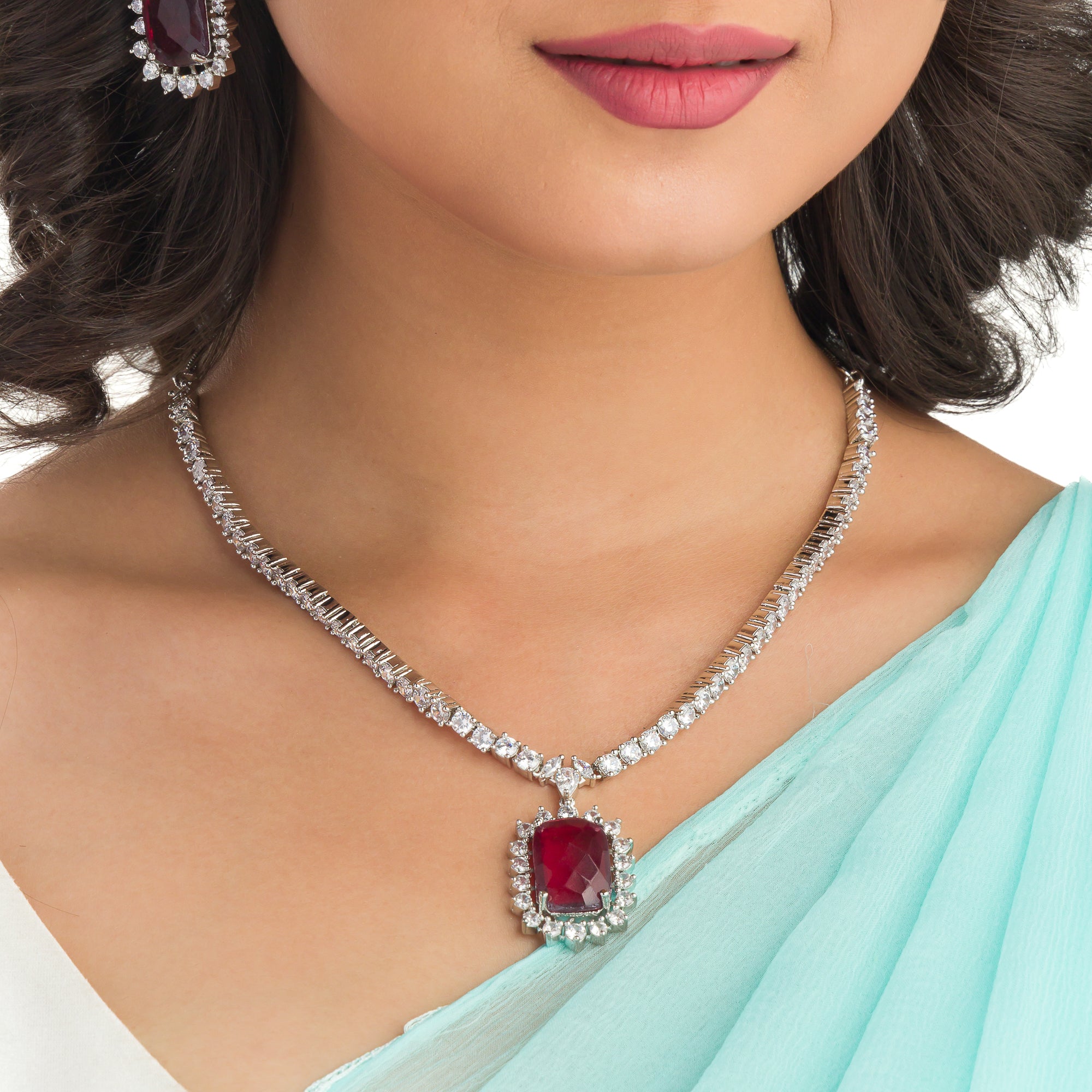"Rich maroon zircon pendant necklace adds sophistication and elegance."
