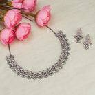 "Square and floral zircon necklace in rose gold blends geometric and floral elegance."
