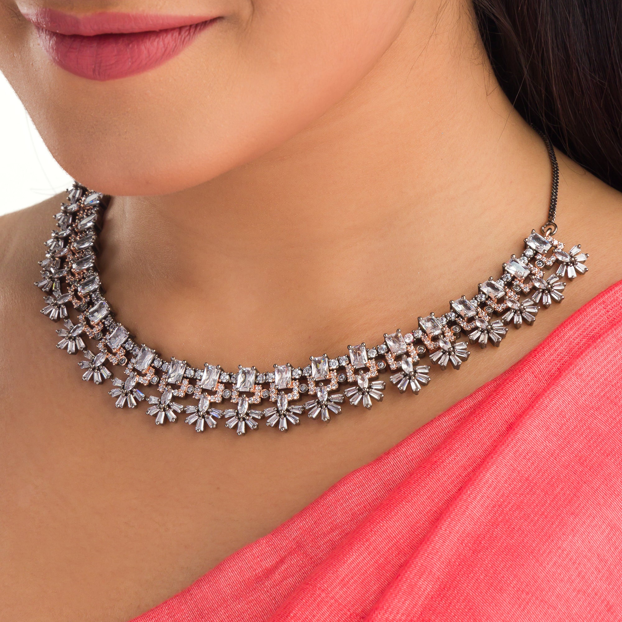 "Square and floral zircon necklace in rose gold blends geometric and floral elegance."
