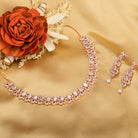 "Understated zircon necklace in silver and rose gold adds timeless elegance."
