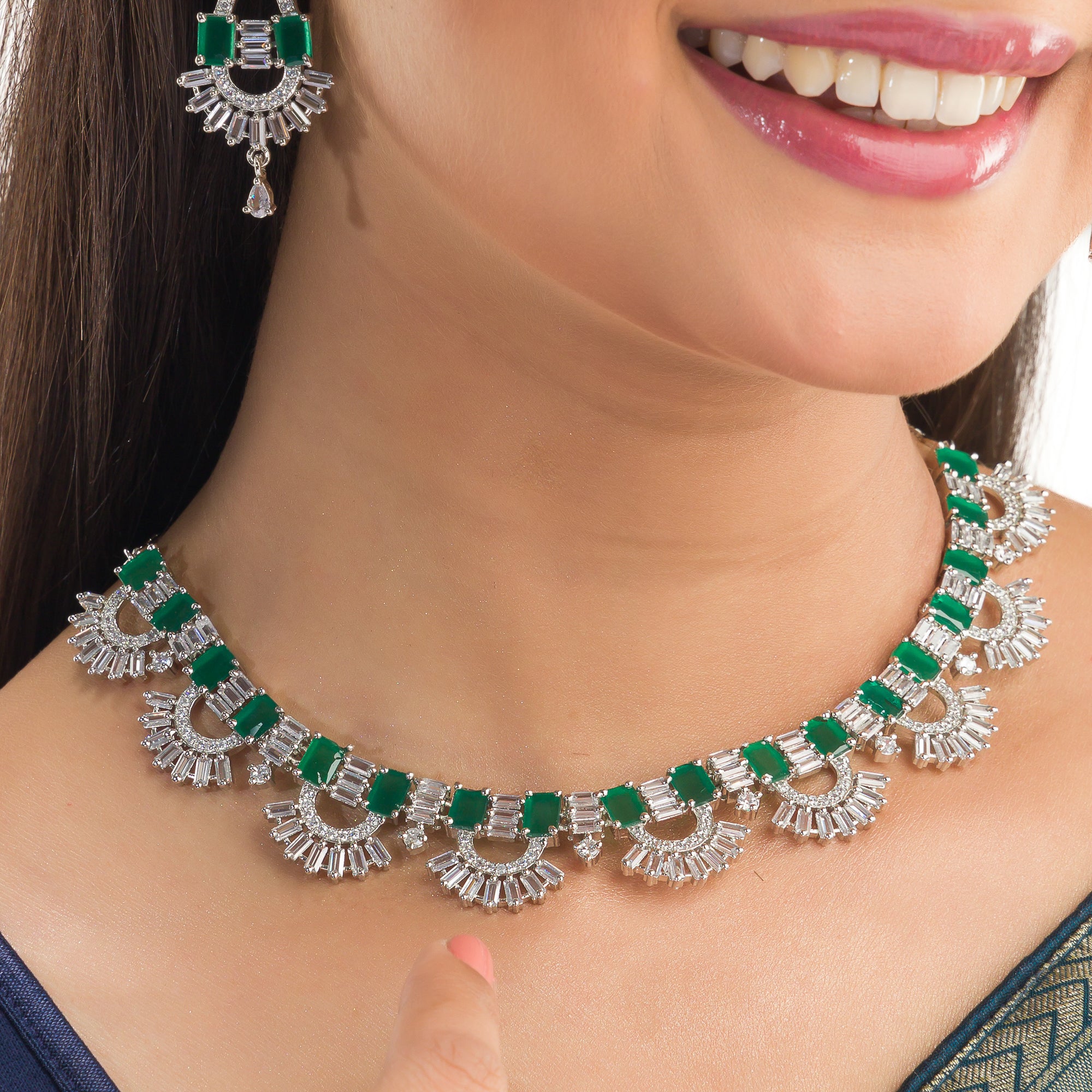 "Green and white zircon necklace in silver delivers a refined, striking elegance."
