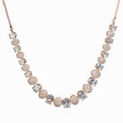 "Rose gold necklace with zircon round stones offers refined elegance and timeless appeal.
