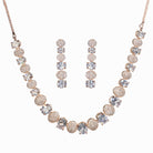 "Rose gold necklace with zircon round stones offers refined elegance and timeless appeal.
