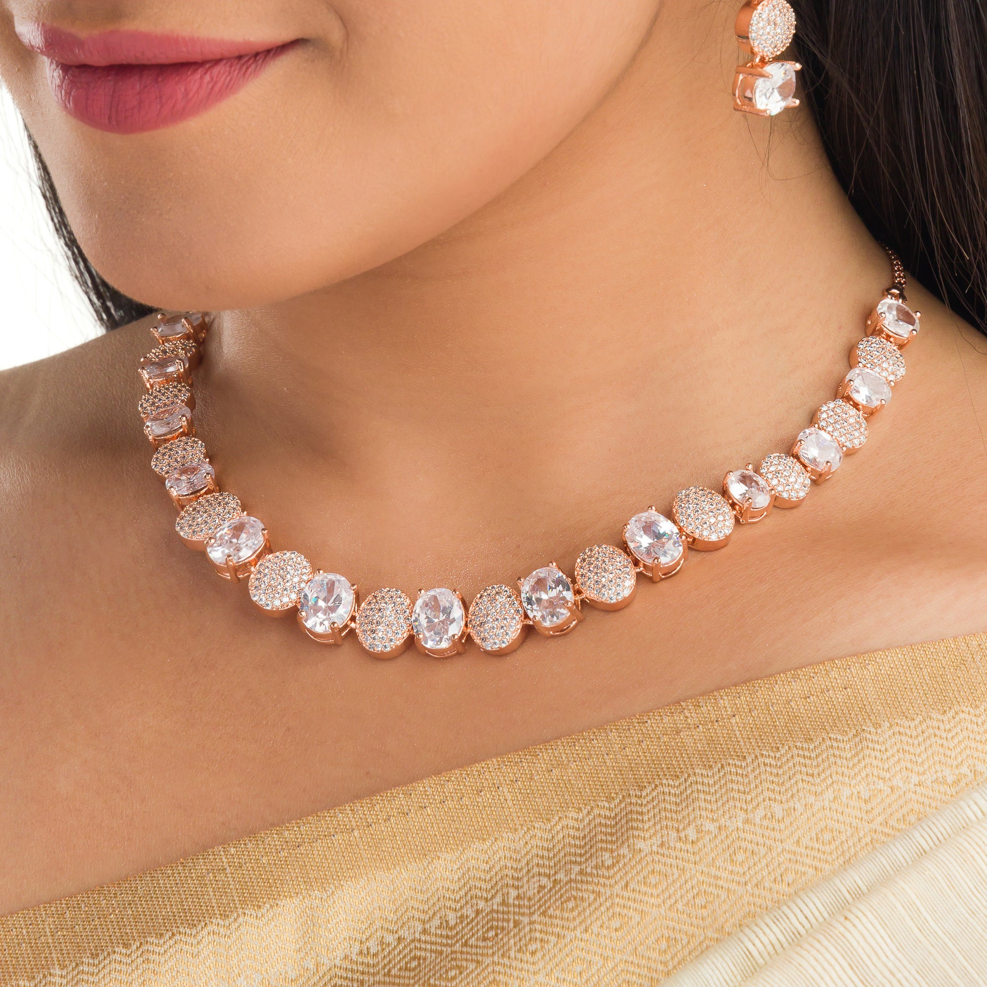 "Rose gold necklace with zircon round stones offers refined elegance and timeless appeal.
