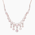 Pink zircon necklace with rose gold polish adds a chic and elegant finishing touch
