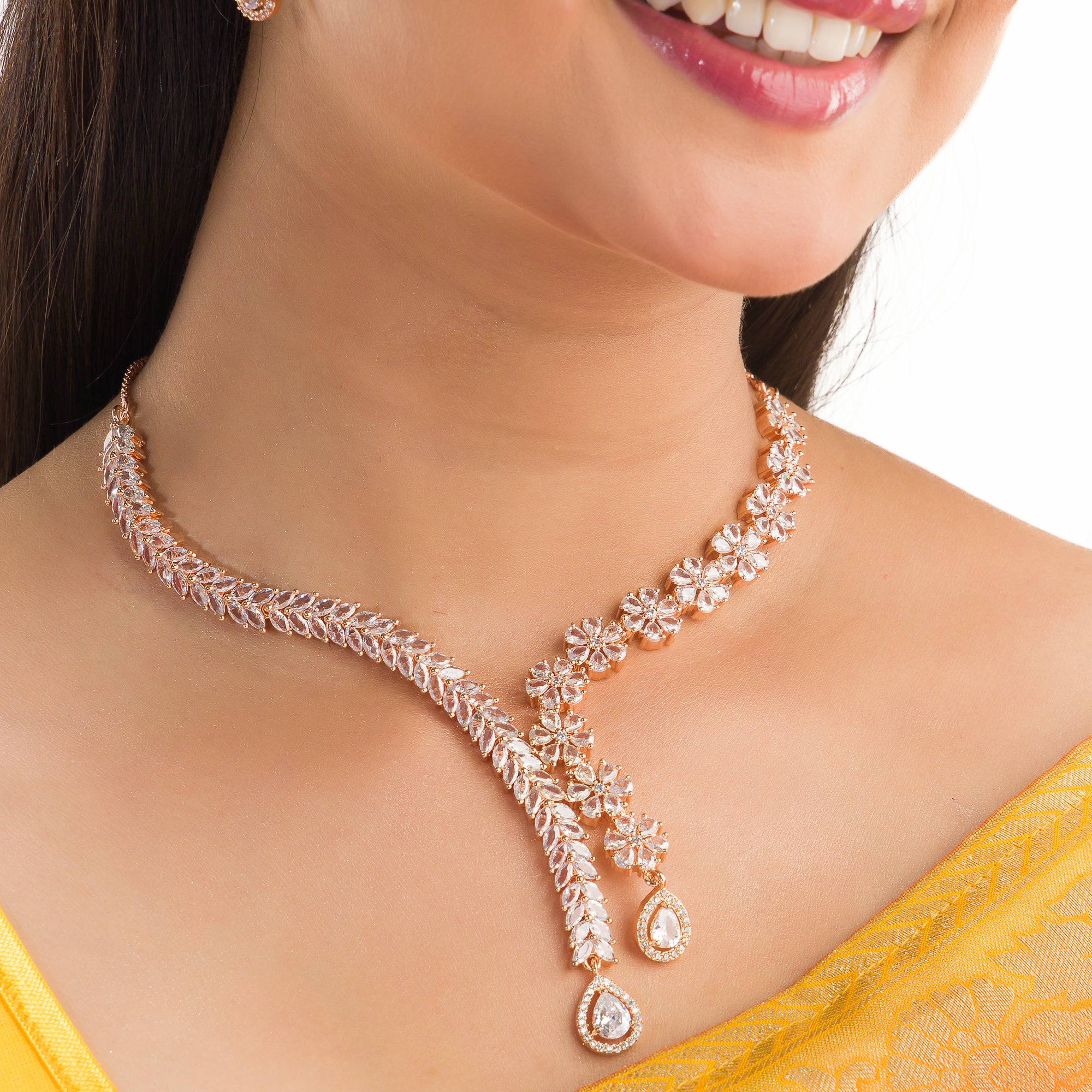 "Flower and leaf design zircon necklace in rose gold offers chic elegance and timeless style."
