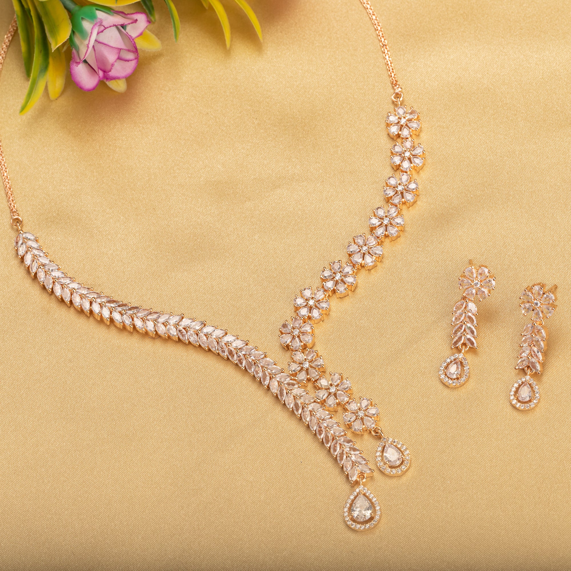 "Flower and leaf design zircon necklace in rose gold offers chic elegance and timeless style."
