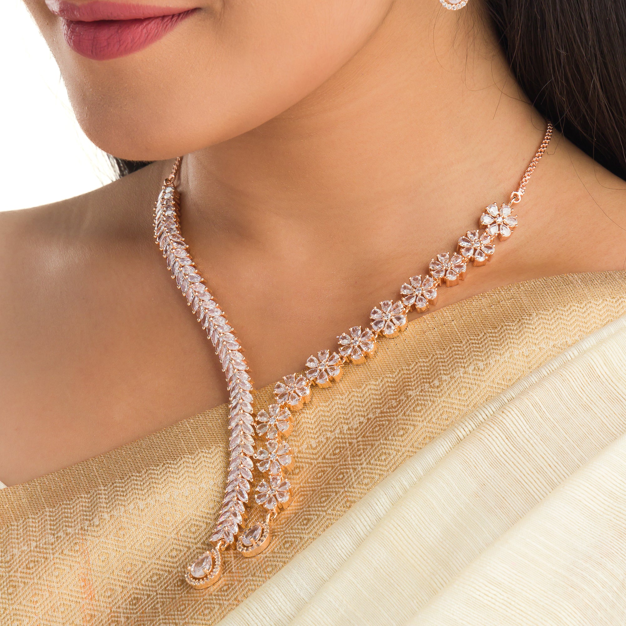 "Flower and leaf design zircon necklace in rose gold offers chic elegance and timeless style."
