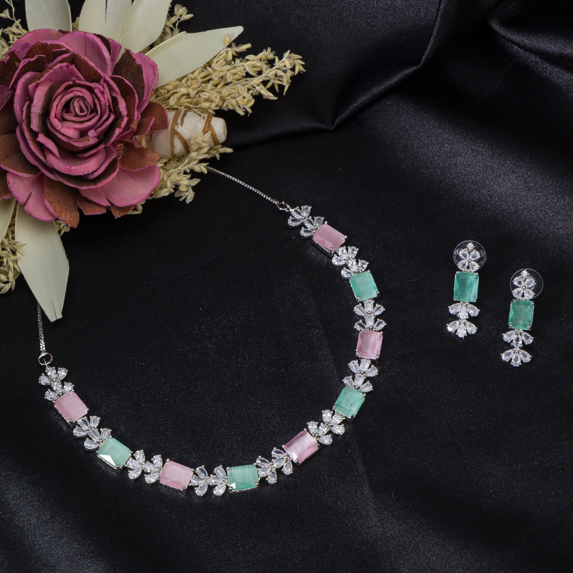"Trendy pink and green zircon necklace in square design offers chic, modern elegance."
