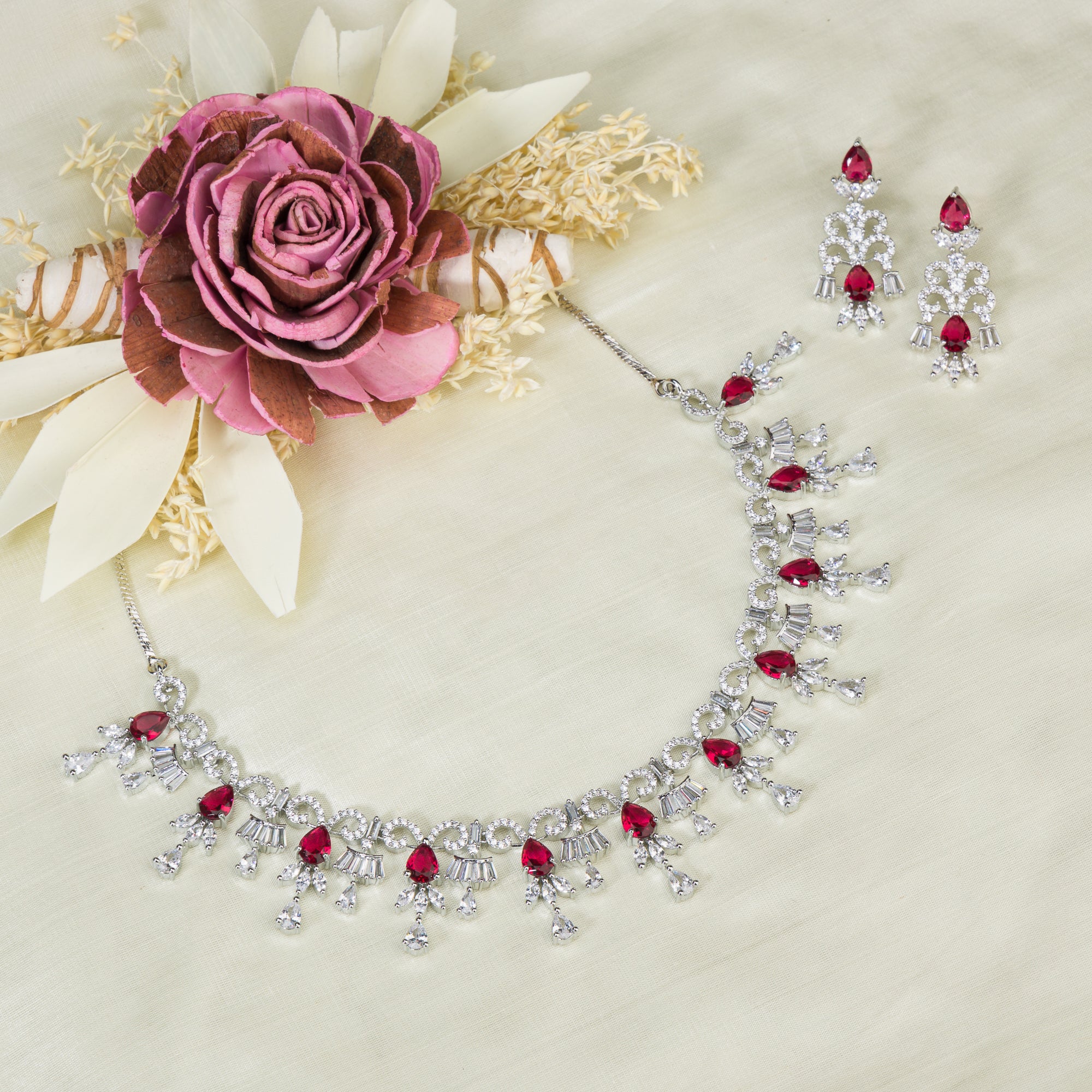 "Red and silver zircon necklace combines sleek silver polish with sophisticated elegance."
