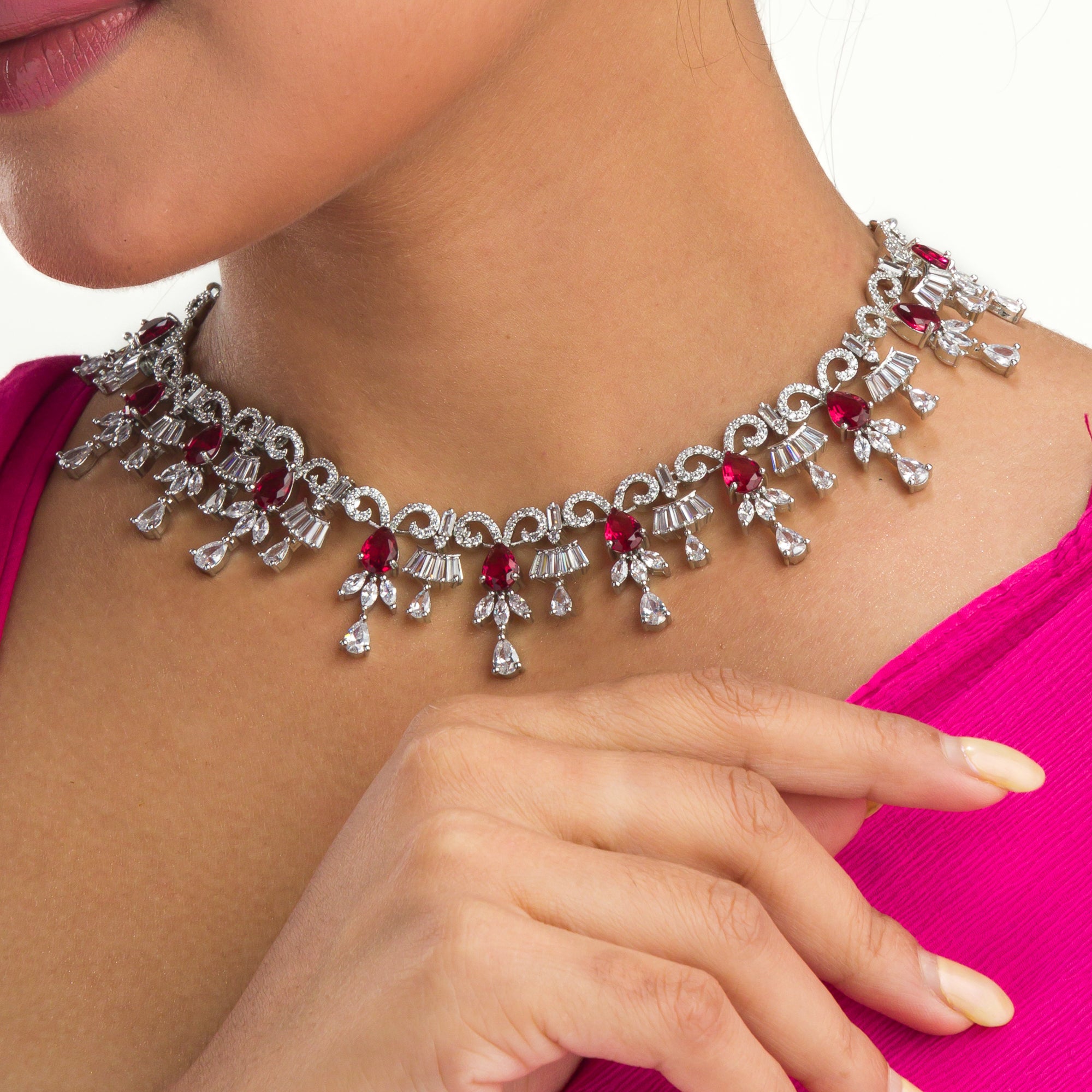 "Red and silver zircon necklace combines sleek silver polish with sophisticated elegance."
