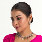 "Red and silver zircon necklace combines sleek silver polish with sophisticated elegance."
