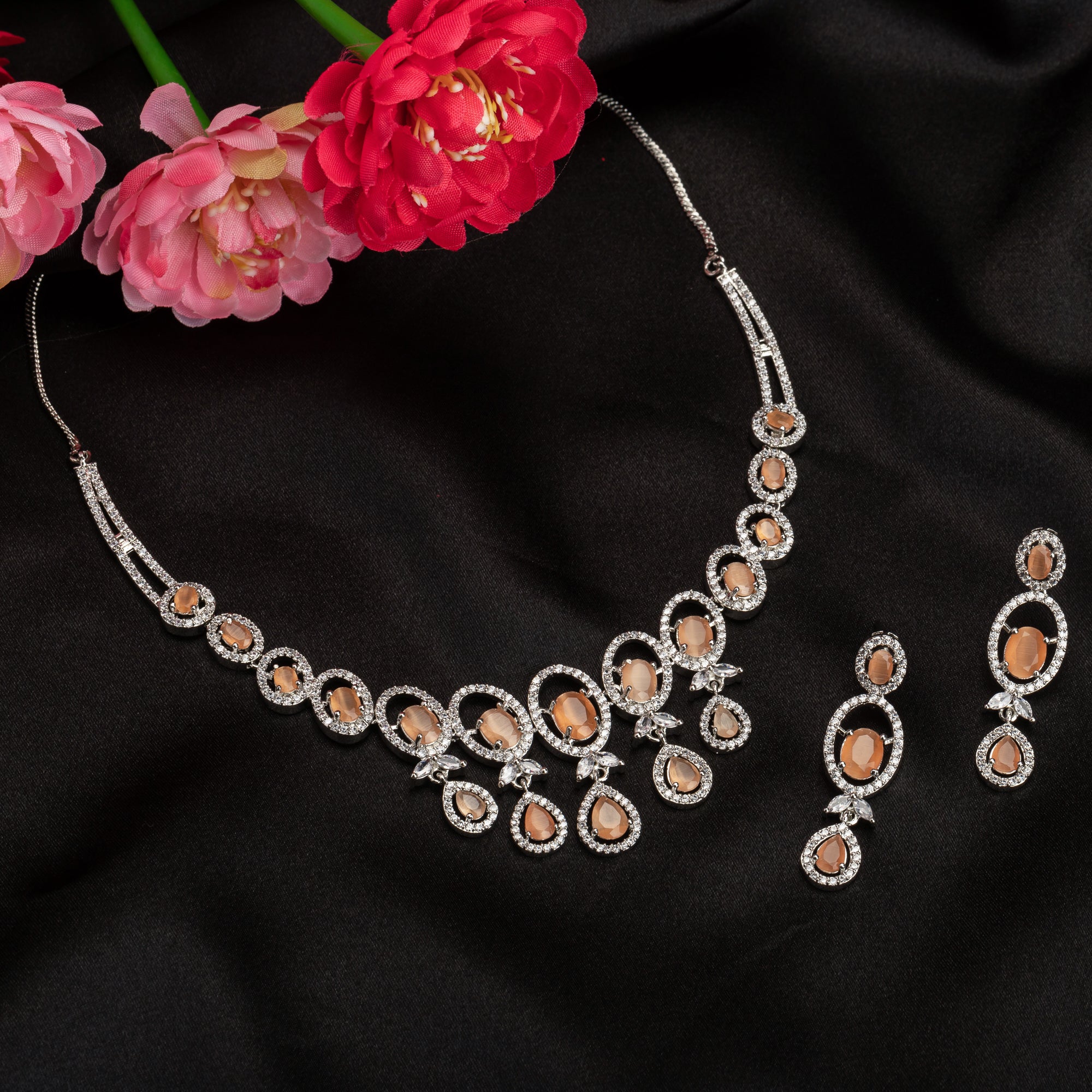 Salmon zircon necklace dazzles with its warm, unique glow for a stylish statement."
